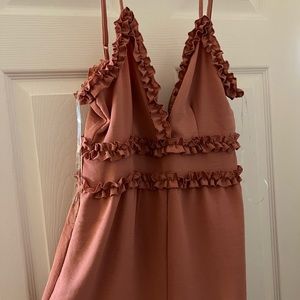 Romper! Never worn! Washed once that’s why tags were removed !